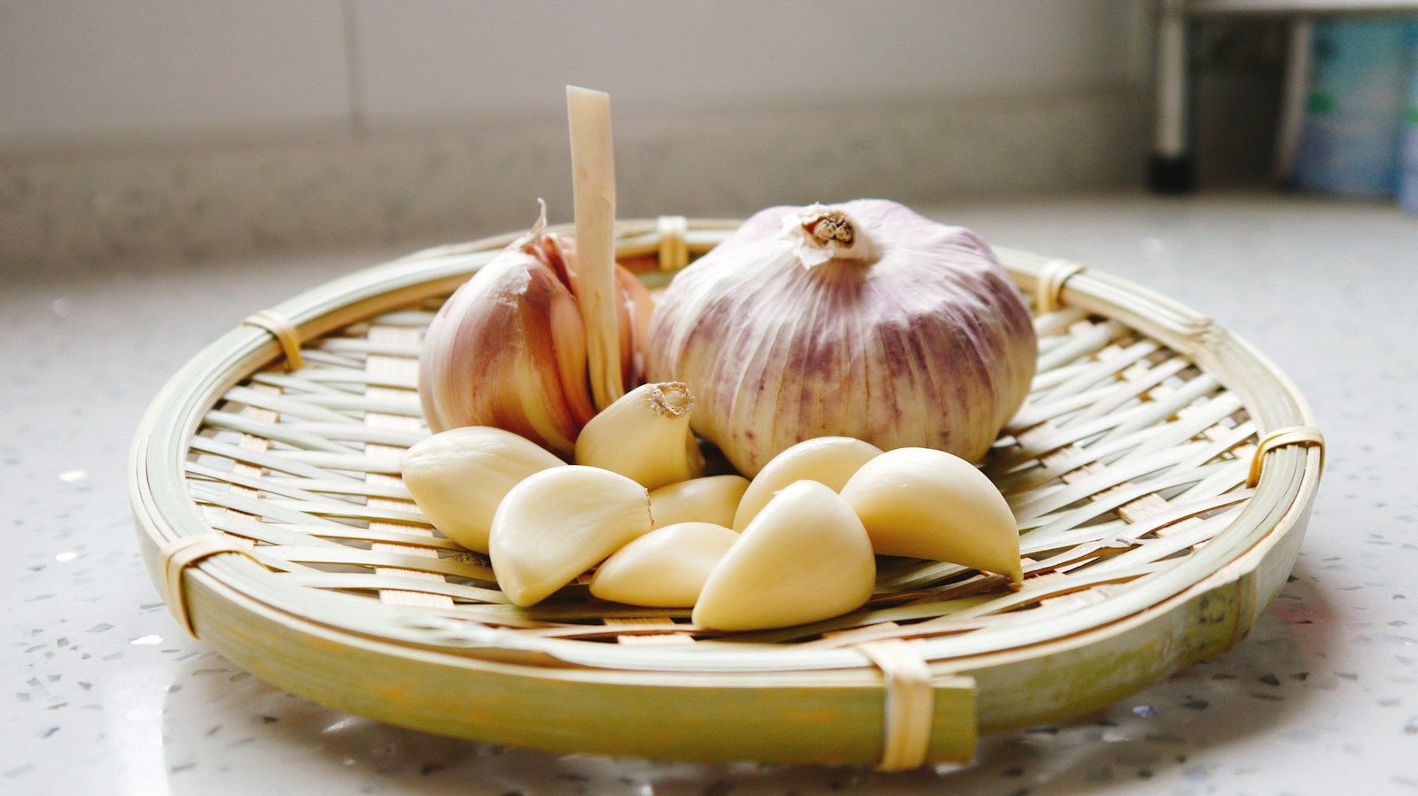 Fresh garlic bulbs in a market basket